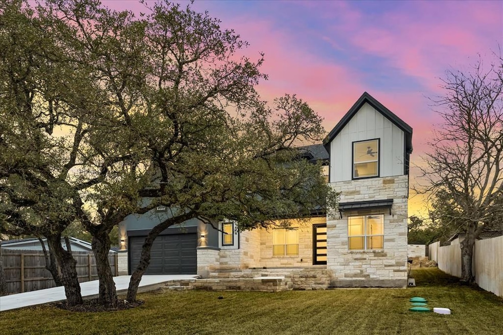 Contemporary home featuring stone siding, concret
