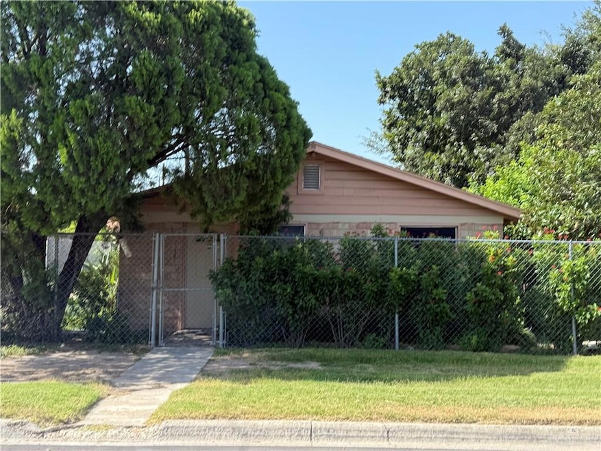 View of front of house featuring a gate.