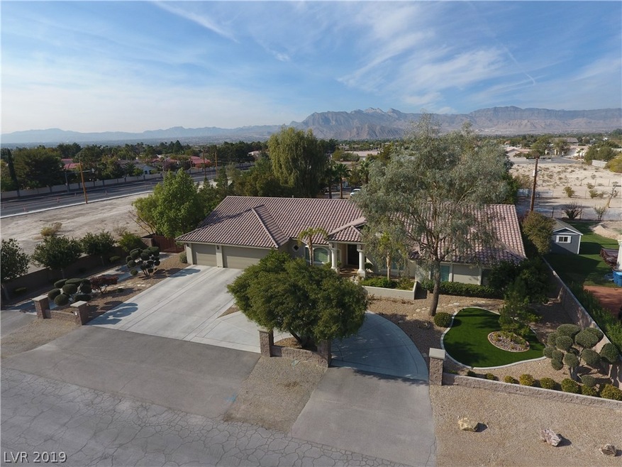 Frontal View of house with circle drive, front wal