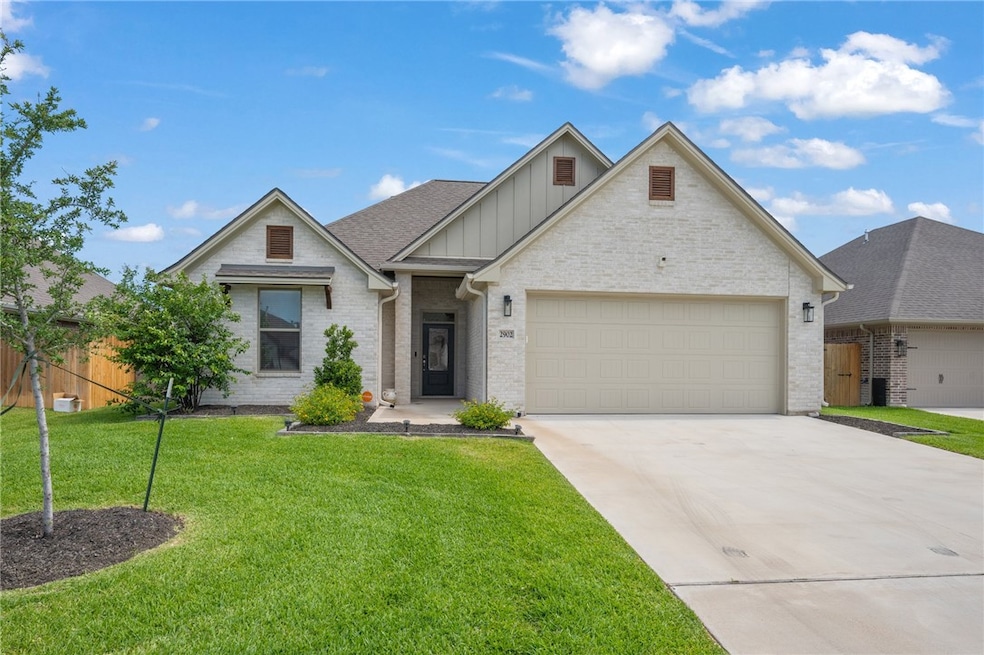View of front of home with fence, concrete drivewa