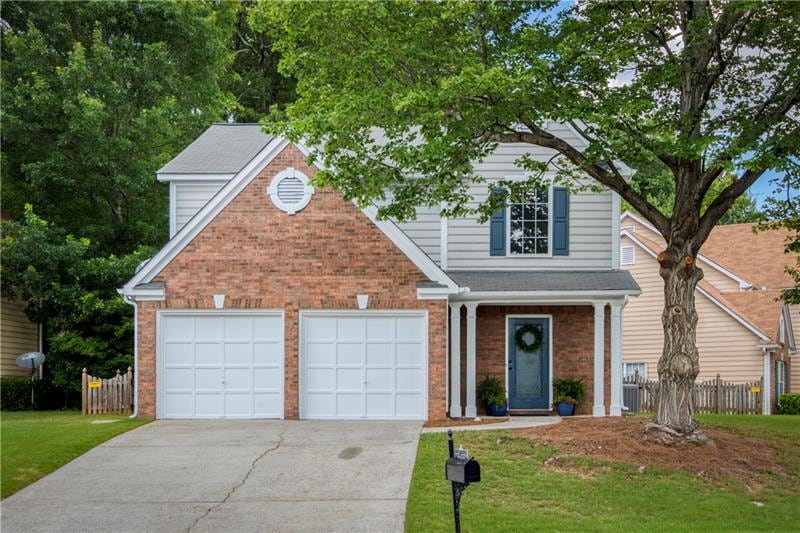Curb appeal galore - situated on a quiet lot towar