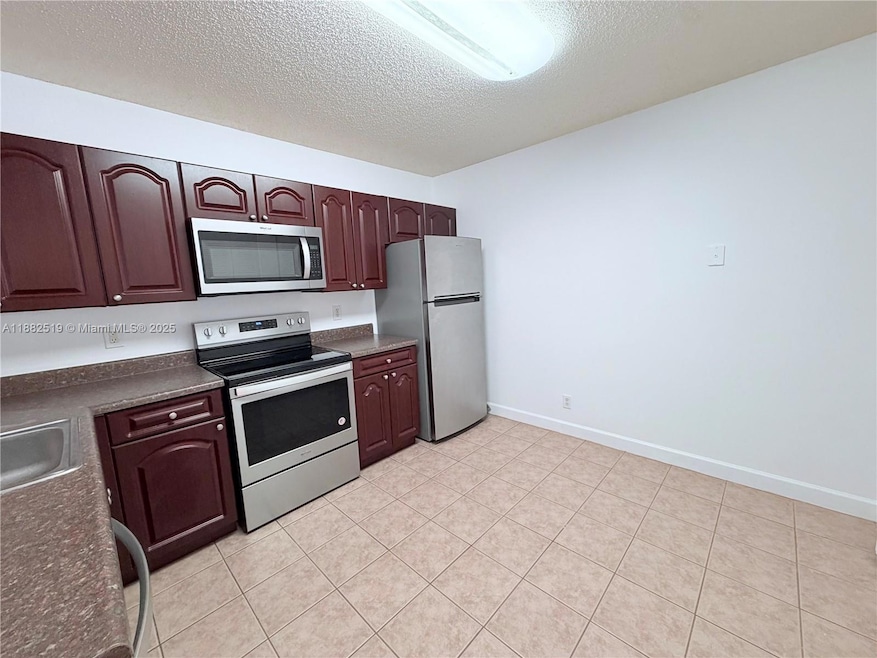 5761 Riverside Dr unit 303B4, Coral Springs, FL 33067 - photo 1