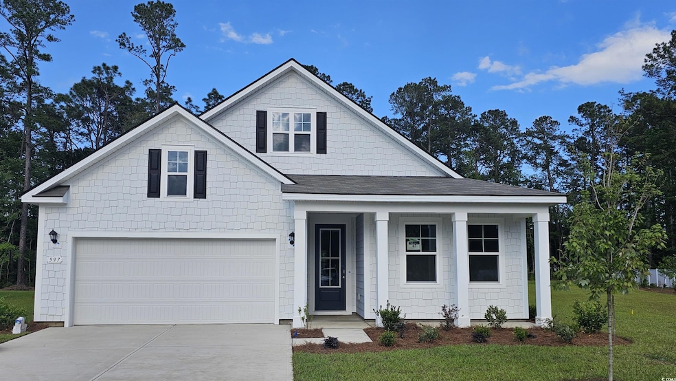 View of front of house featuring concrete driveway, a porch, a garage, a front lawn, and a shingled roof