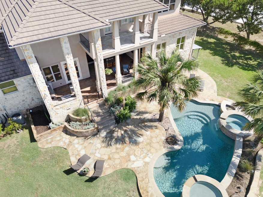 View of pool featuring a pool with connected hot 