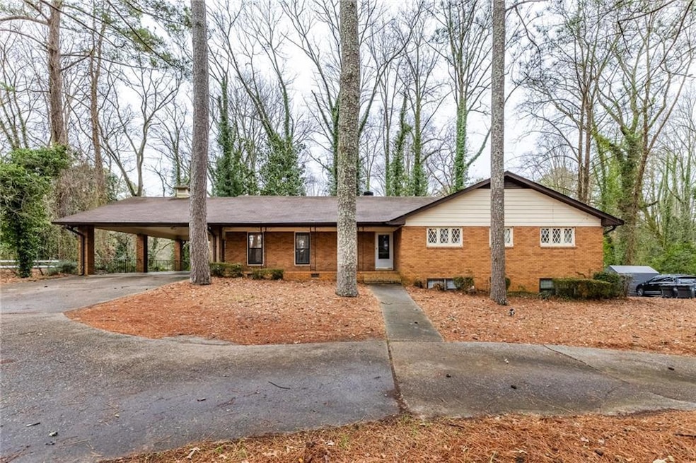 View of front of property featuring a carport