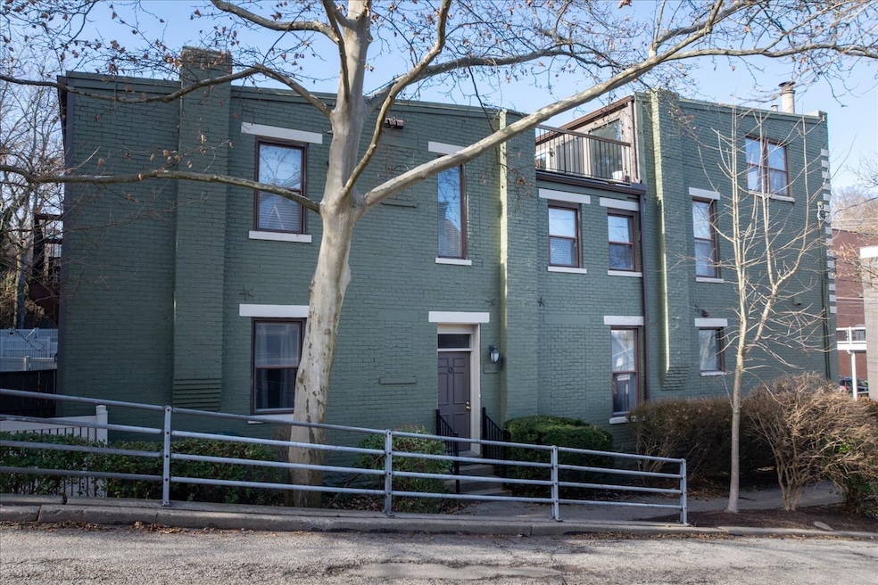 Side View of building shows entrance to home facin