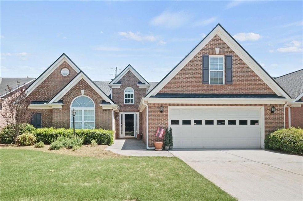 View of front of house featuring a garage and a fr