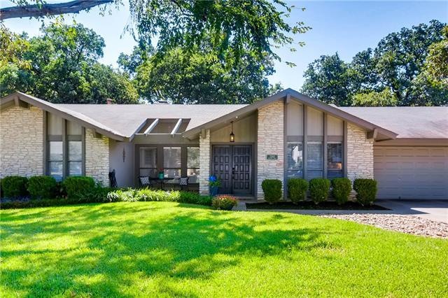 Gorgeous home on wide lot with mature trees in fro