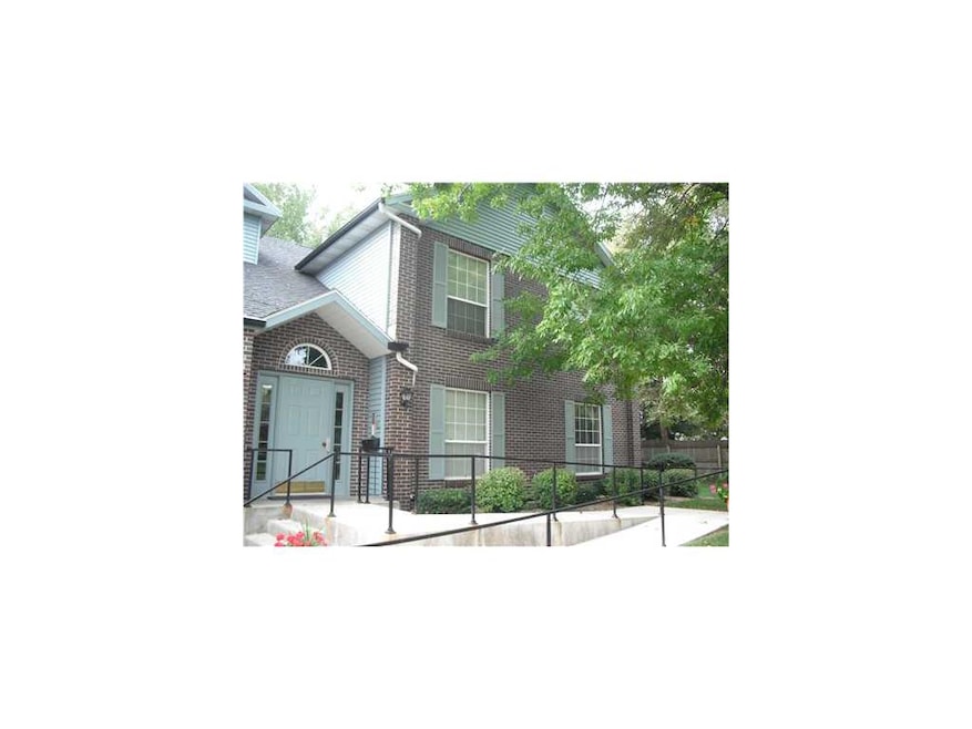 Front Exterior. Condo building is at the end of de