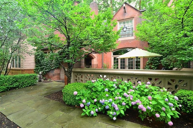 The charming walkway leads to the front door of th
