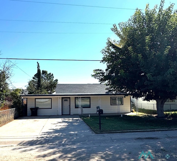 Ranch-style home featuring concrete driveway and a porch