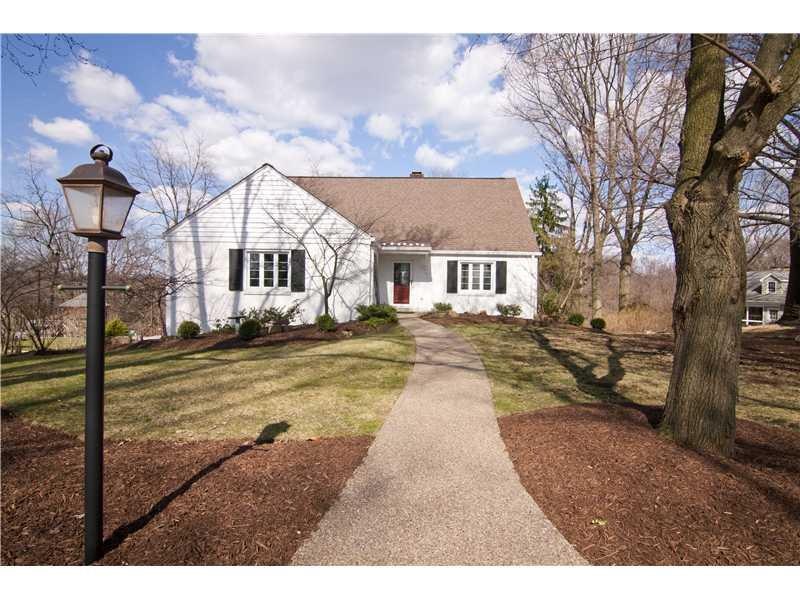 Exterior Front. Two story, cape cod style brick ho