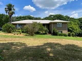 4 SIDED BRICK WITH NEWER TIN ROOF