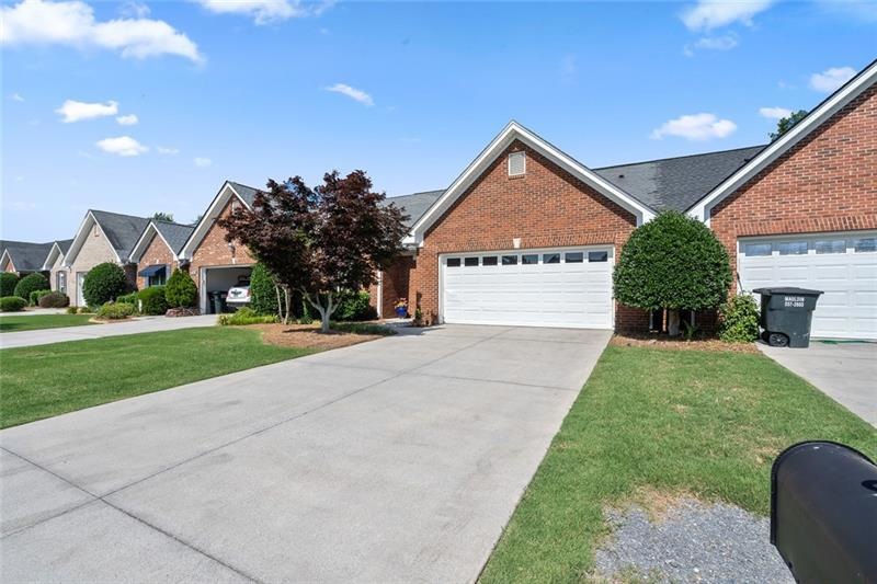 Beautiful Maintenance Free Brick on Front and Back, Spacious Garage and Japanese Maple in Front Yard