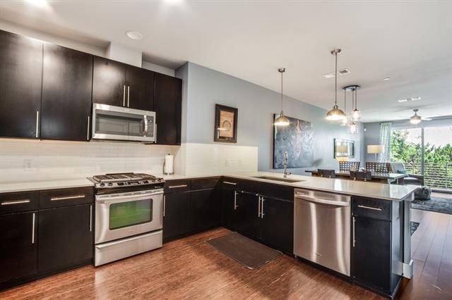 Beautiful large open kitchen with white quarts cou