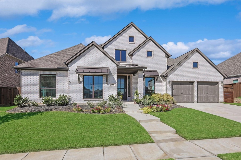 View of front of property with a garage and a fron