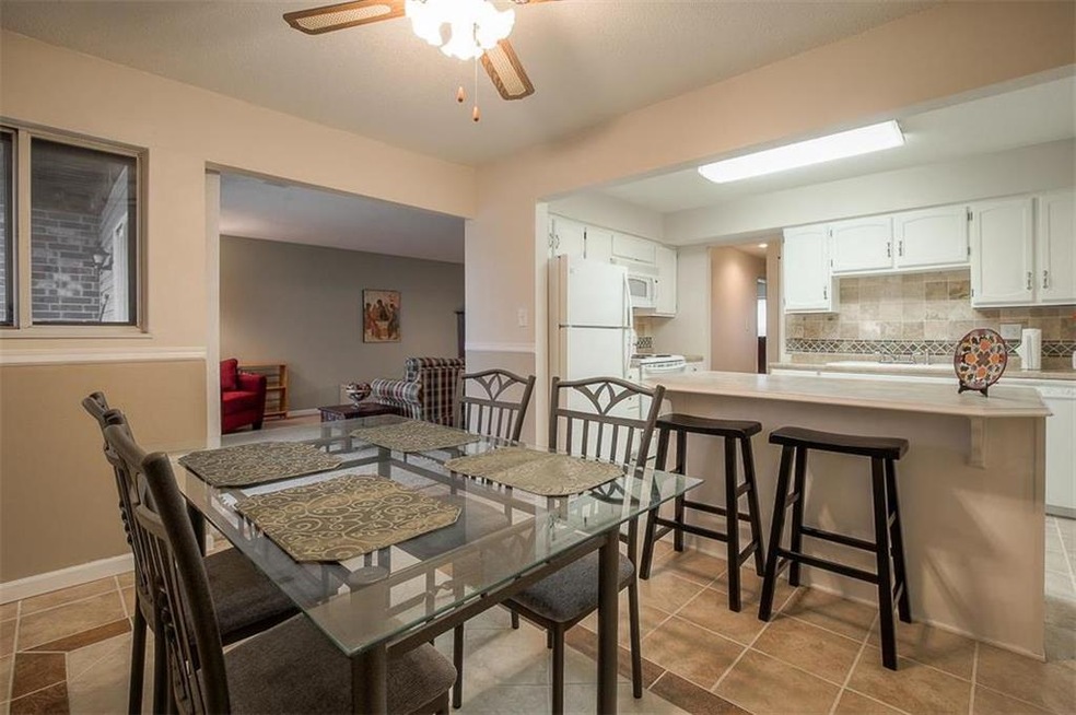 Bright White Kitchen with Dining Window out to the