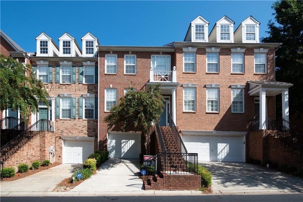 Townhome / multi-family property with a garage