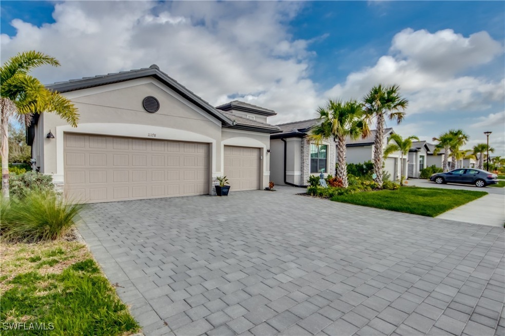 View of front facade featuring a garage, decorativ