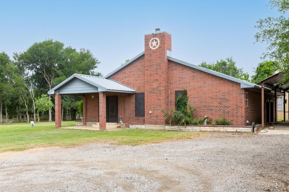 View of front of home with a chimney, a front yar
