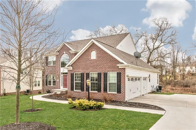 All Brick-Front with 3-car side garage and concret