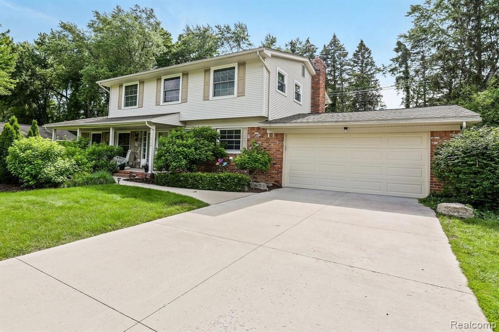 Welcome to 6738 Spruce - note newer driveway, attached 2 car garage andwooded setting.