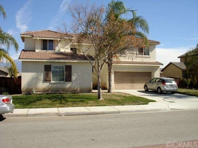 Front of home with possible RV access on the left,