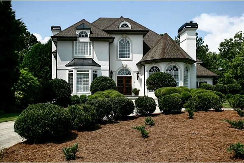 Exterior Front. There is an Ambassador driveway in
