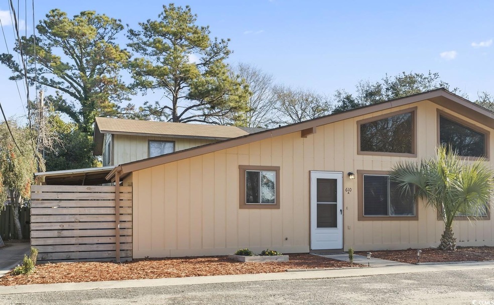 View of front of house with a carport