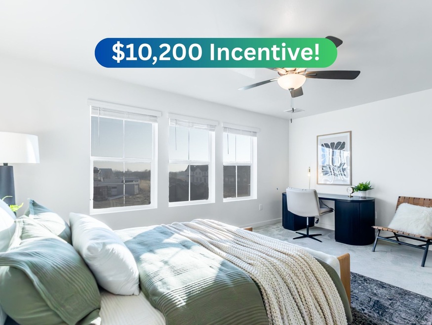 Bedroom featuring an office area, carpet, and a ceiling fan