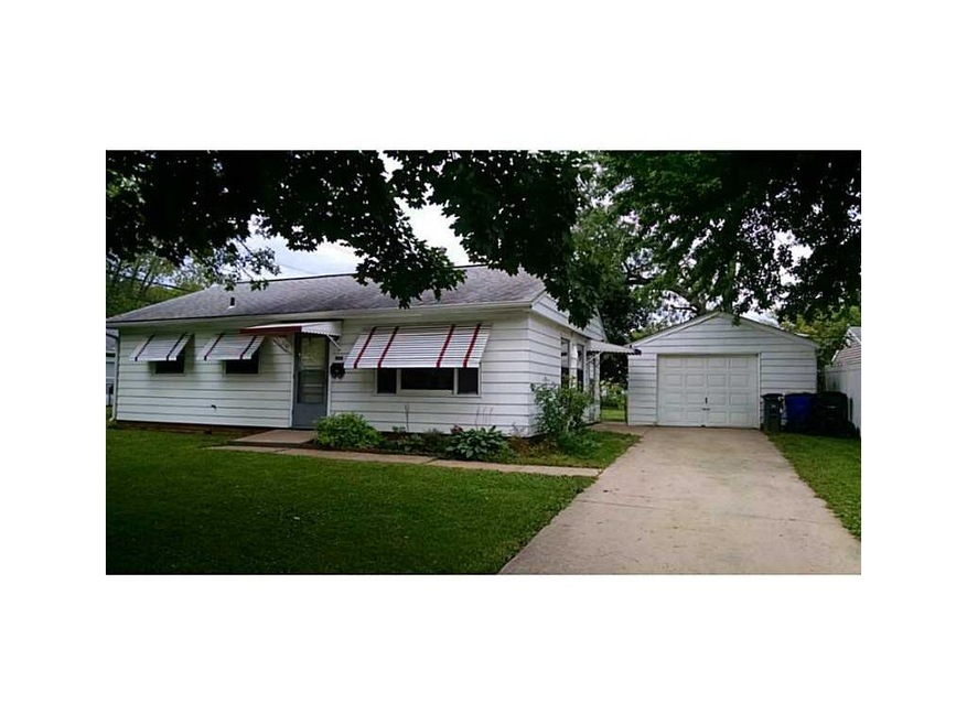 Front Exterior. Shaded, tree-lined street.