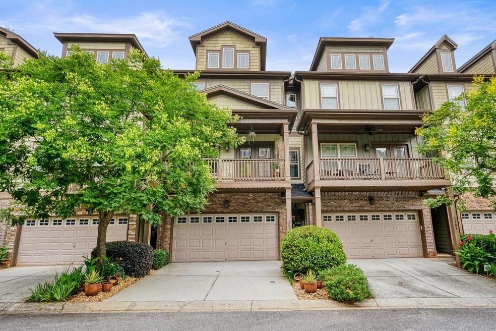 Immaculate 3 Level Townhome with 2 car garage & large front porch!
