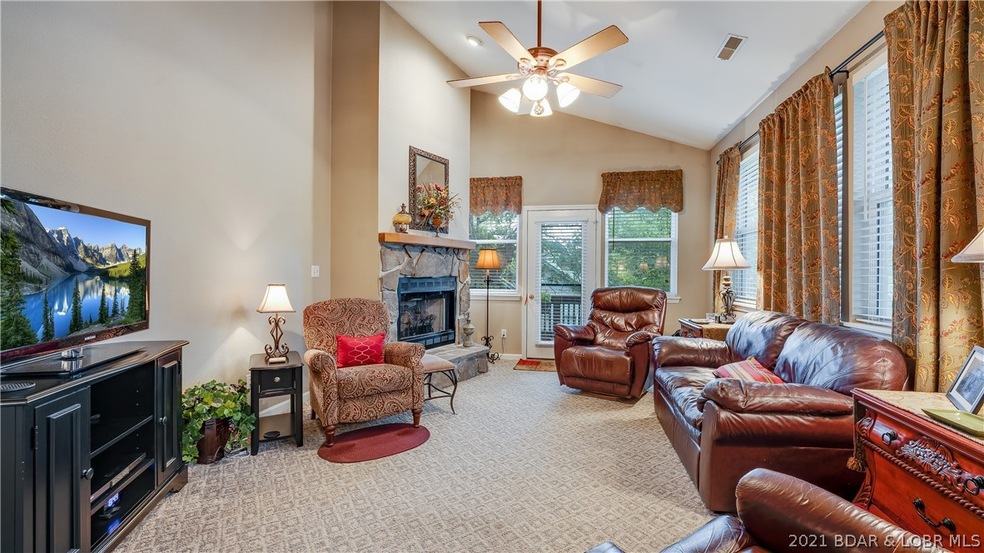 Spacious living room with vaulted ceilings and gas