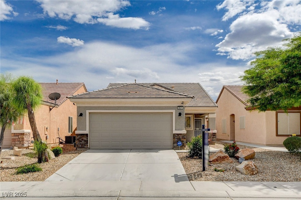 Ranch-style house with an attached garage, stucco