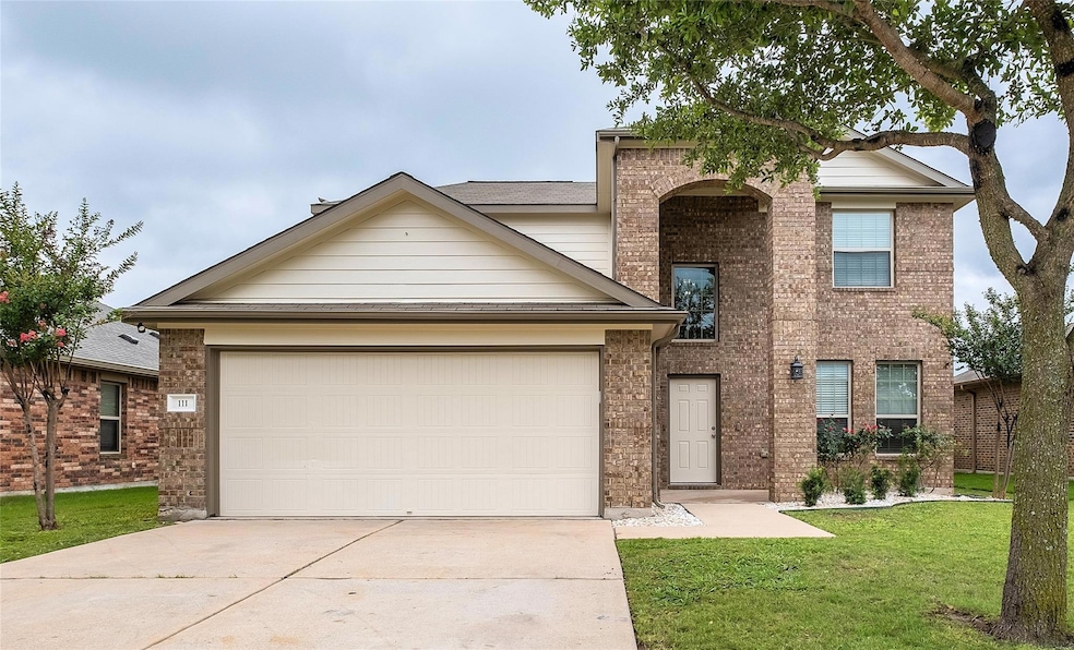 Traditional-style home with concrete driveway, br