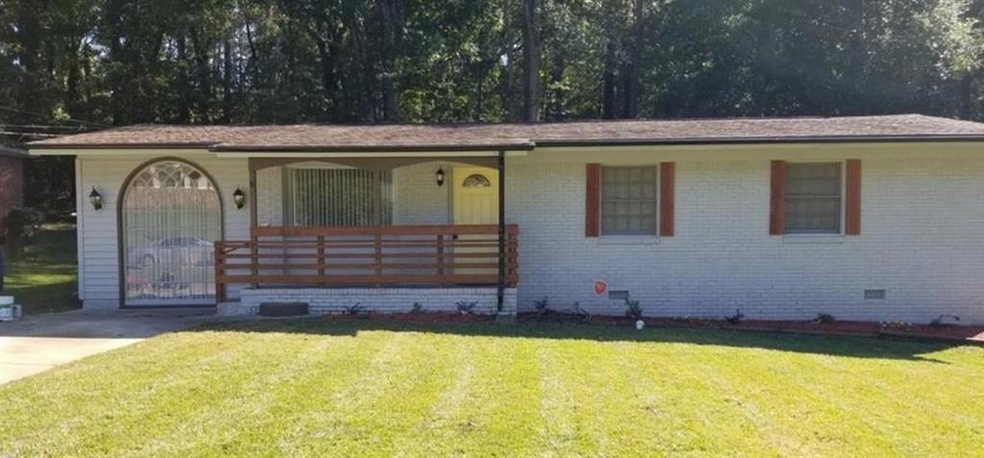View of front of home with covered porch and a fro