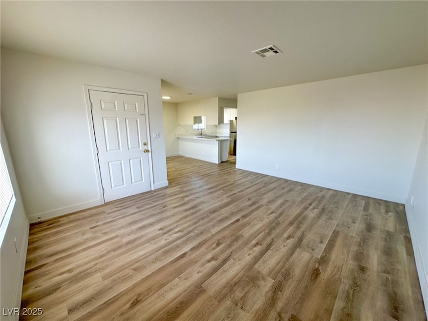 Unfurnished living room featuring light wood-type