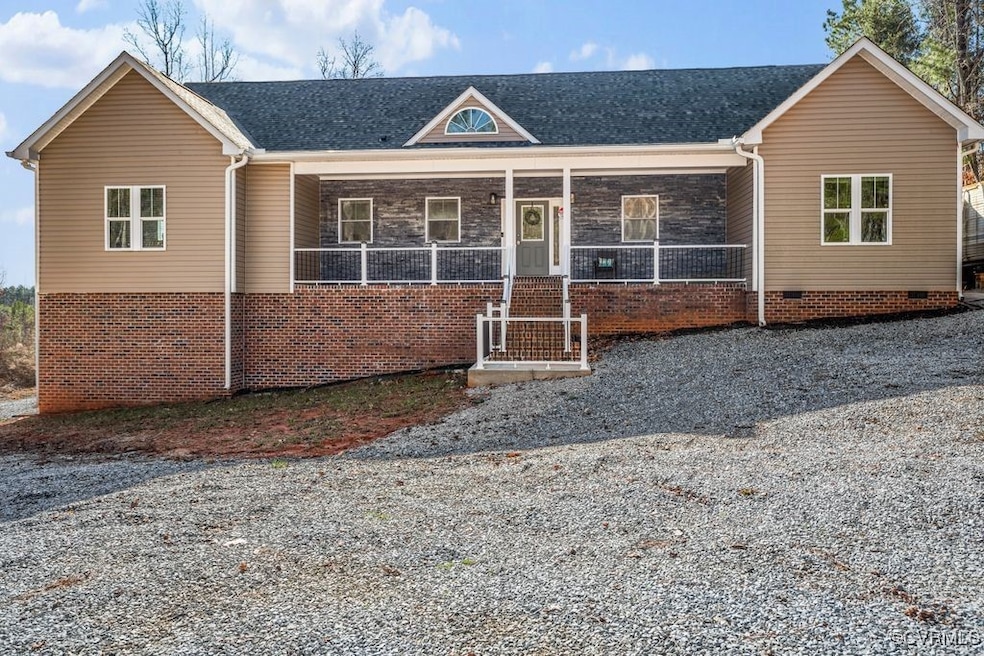 Ranch-style house with covered porch, vinyl siding