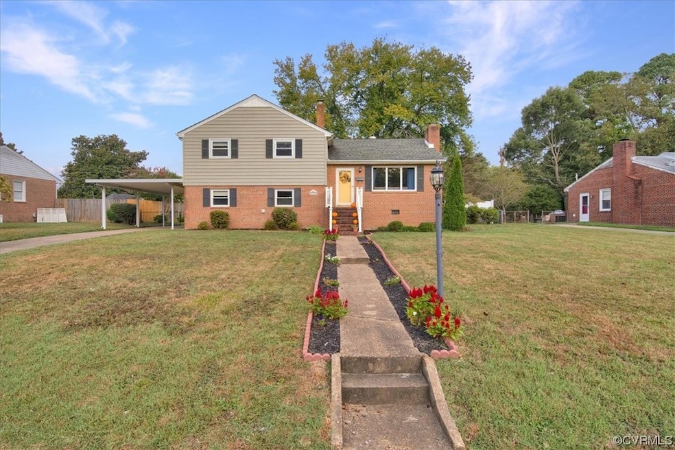 Split level home with a front yard