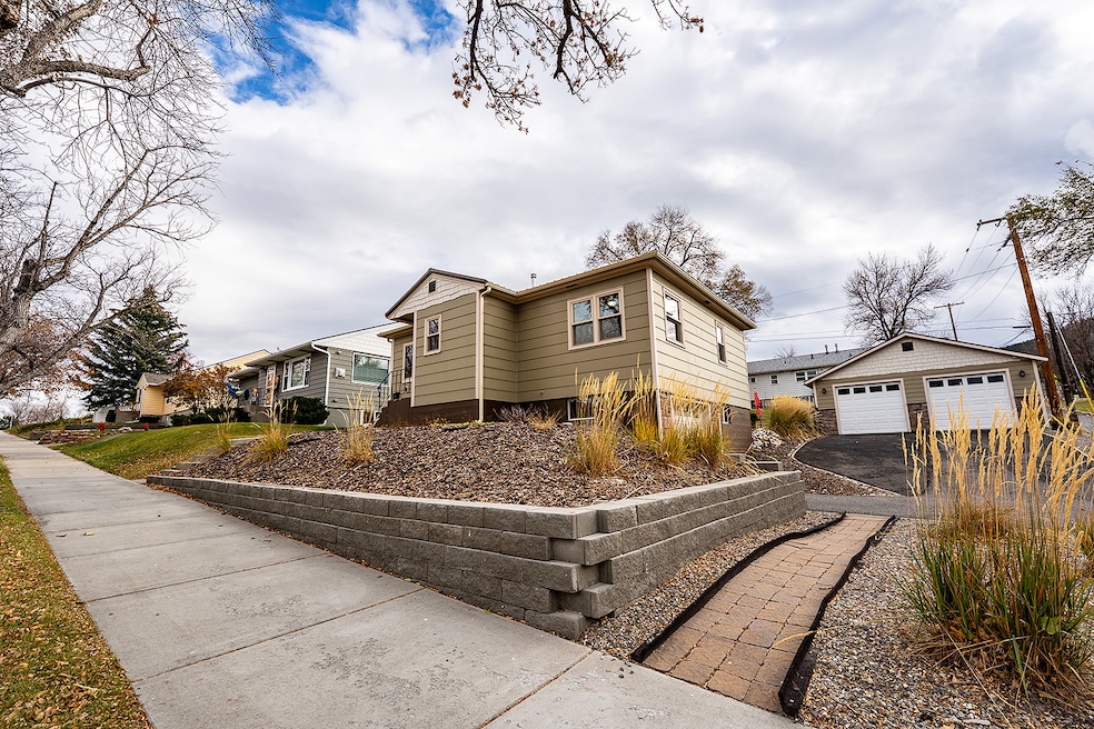 View of front of house , garage, and a residential view