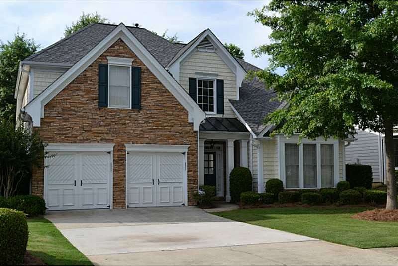 Exterior Front. Professional landscaping. Sprinkle