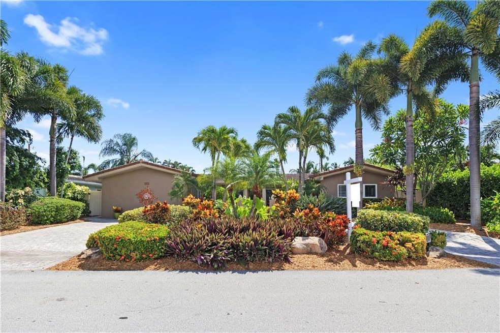 Welcome to 4420 NE 18th Ave. Stunningly landscaped on a beautiful quiet street.