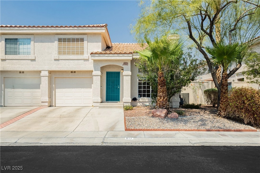 Mediterranean / spanish home with driveway, stucco