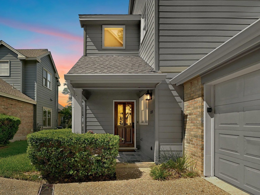 Entrance to property featuring a shingled roof an