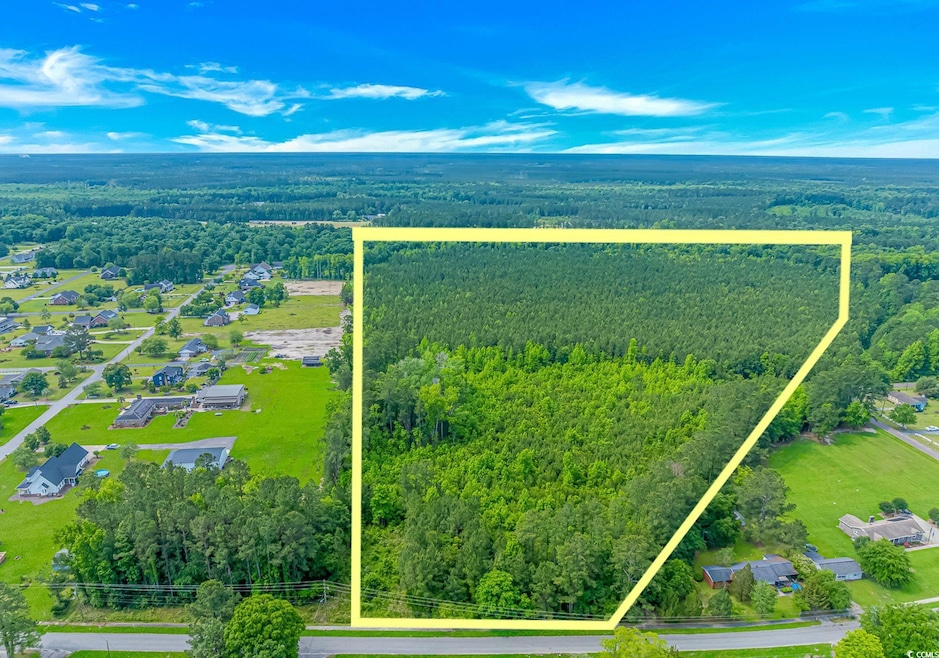 Aerial view of property's location with a heavily 