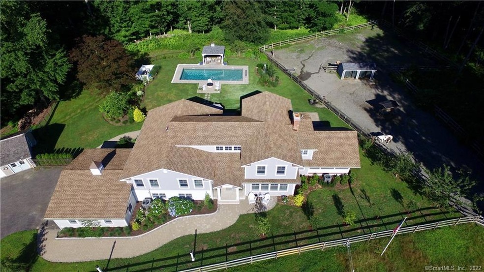 Located on 2.1 acres, this 4533 sq ft home feature