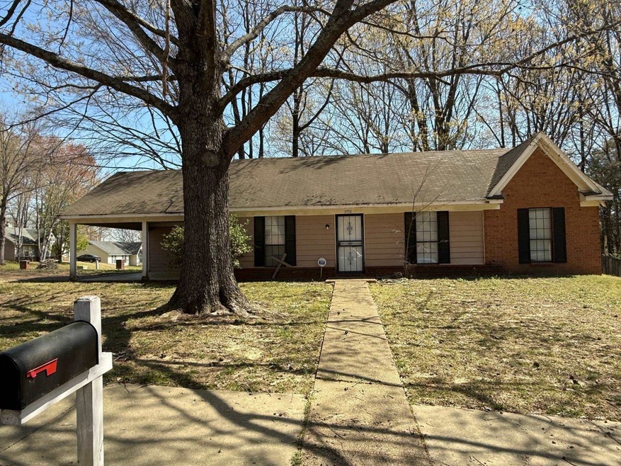 Ranch-style house featuring brick siding