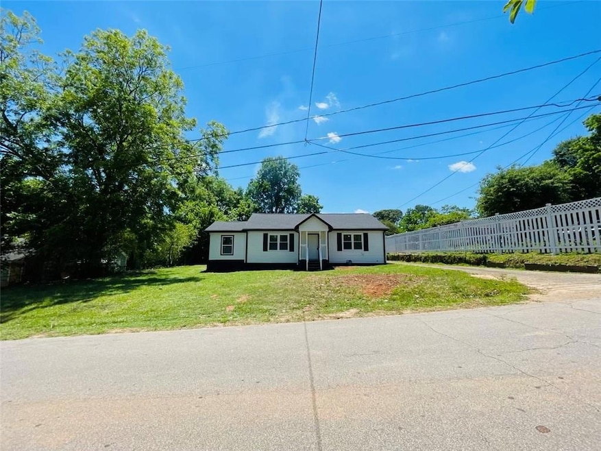 Ranch-style home with a front yard