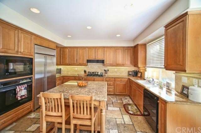 Gourmet Kitchen Features Large Island with Bar Sea