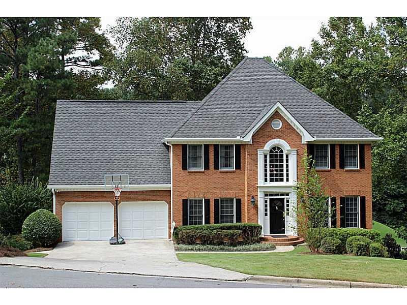 Exterior Front. Stately brick traditional at end o